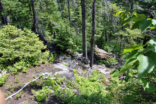 a rope to aid hikers down the steep path