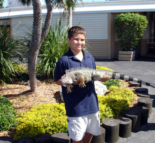 Alex Jones with a big iguana