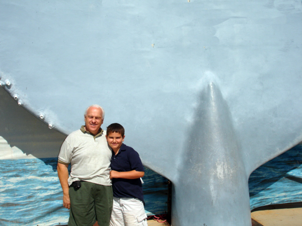 Lee Duquette and his grandson with a whale's tail