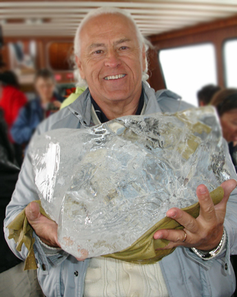 Lee Duquette with A chunk of ice from the water is brought aboard the ship 