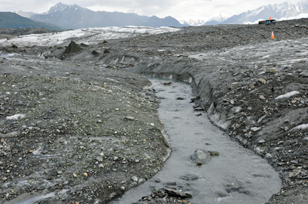 water melting and traveling down the glacier