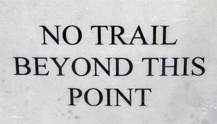 sign - no trail beyond this point