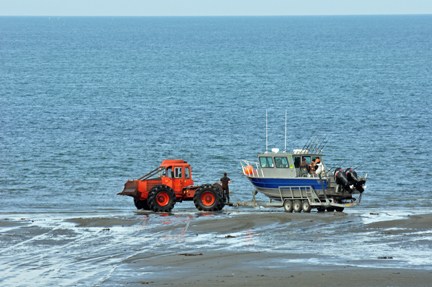 boat being towed by a tractor