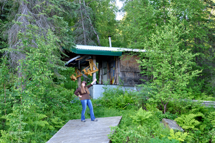 Karen Duquette by the cabin