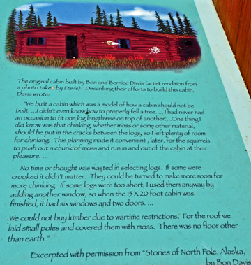 sign about the log cabin