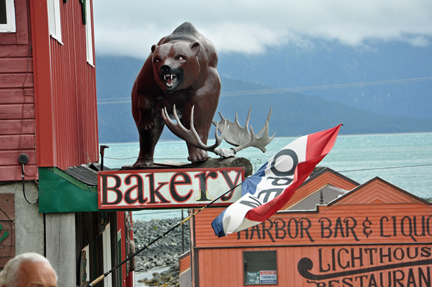 bear statue above the bakery
