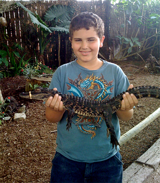 Alex holding a baby alligator