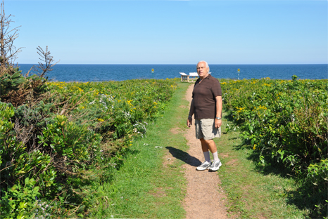 Lee Duquette walking the path to the red cliffs at PEI