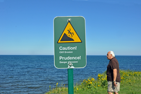 Lee Duquette sees the caution sign at PEI red cliffs