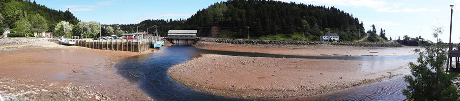 Panarama view of the covered bridge and low tide in St. Martins