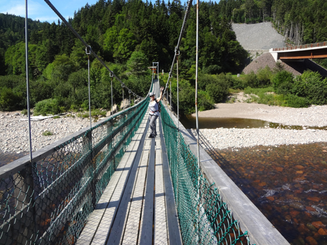 Karen Duquette on a suspension bridge over Big Salmon River