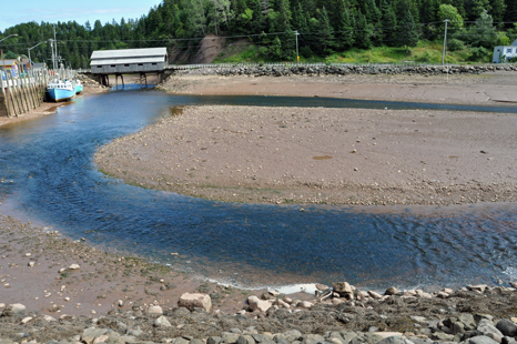 covered bridge at low tide in St. Martins