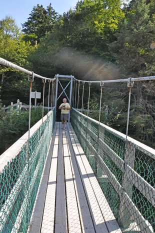 Lee Duquette on an suspension bridge over the Big Salmon River 