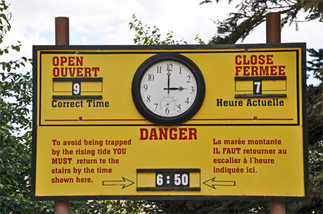 clock and sign warning