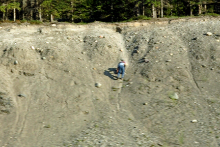 climbing a steep sand bank