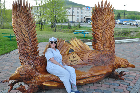 Karen Duquette on an eagle bench