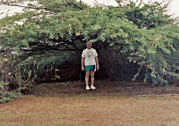Lee Duquette under a divi divi tree