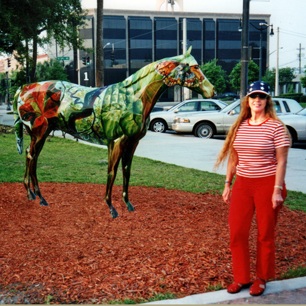 Karen Duquette by a painted horse