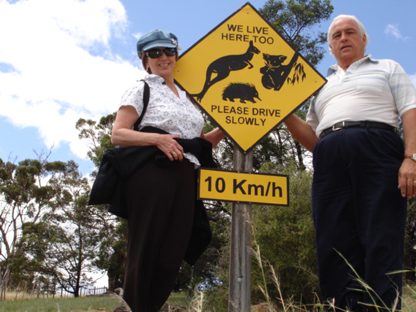 Karen and Lee Duquette and a wildlife sign