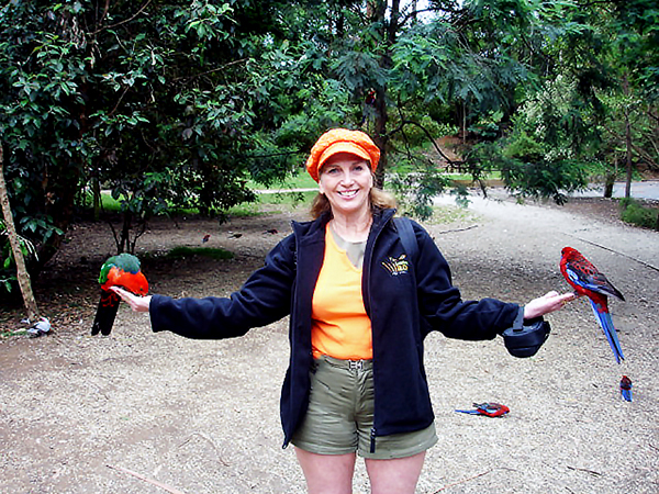 Karen Duquette feeding a bird