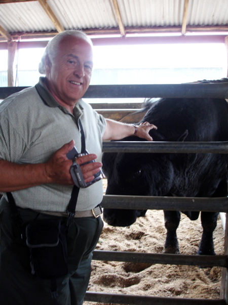 Lee Duquette petting a cow