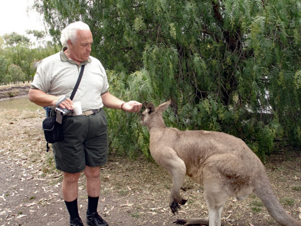 Lee Duquette feeding a kangaroo
