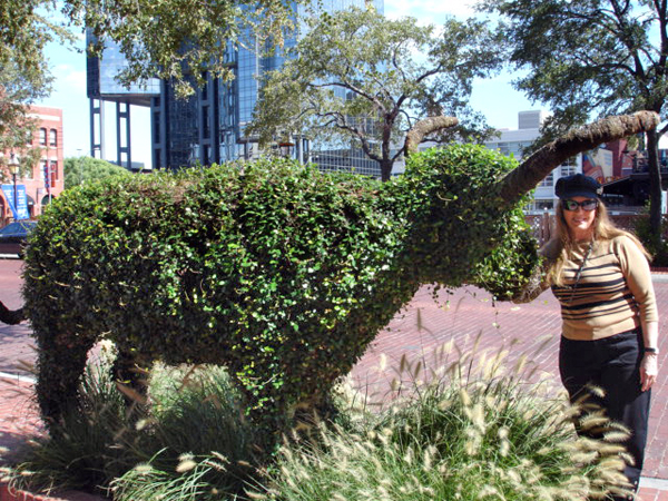 Karen Duquette with an animal bush