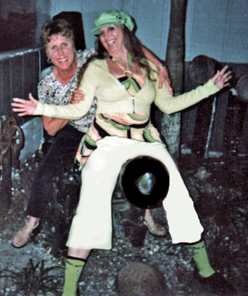 Sharon Dickerson and Karen Duquette ride a cannon