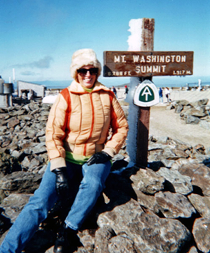 Karen Duquette at the Mt. Washington Summit sign