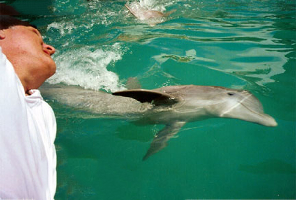 Lee Diuquette and a dolphin at Paradise Island Bahamas