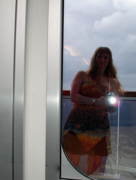 Karen Duquette on the small balcony off of her room