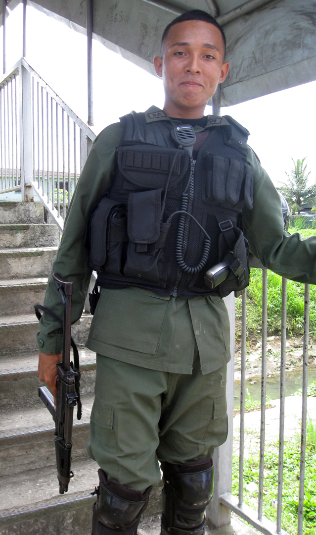 policeman, heavily armed 