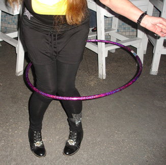 Karen hula hoops with her knees