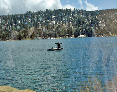 an outhouse on the lake