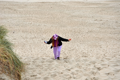 Karen struggles to get back to the top of the sand dune