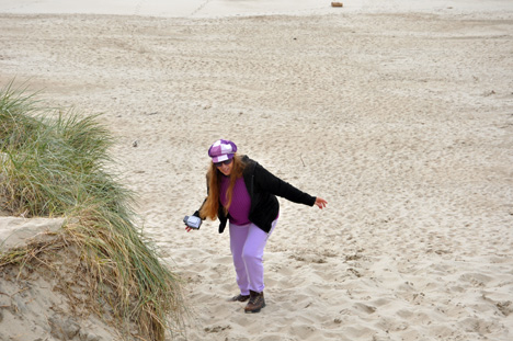 Karen struggles to get back to the top of the sand dune