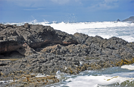 waves crash upon the rocks