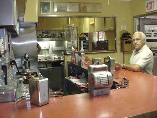 Lee at the counter in the diner