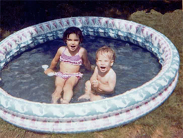 Brian and his sister play in the pool