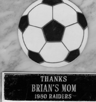 Brian's mom gets a soccer plaque for being the soccer assistant