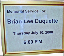Memorial sign for Brian Lee Duquette