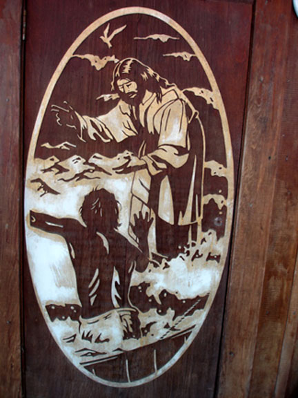 Carving on the door at the Outpost